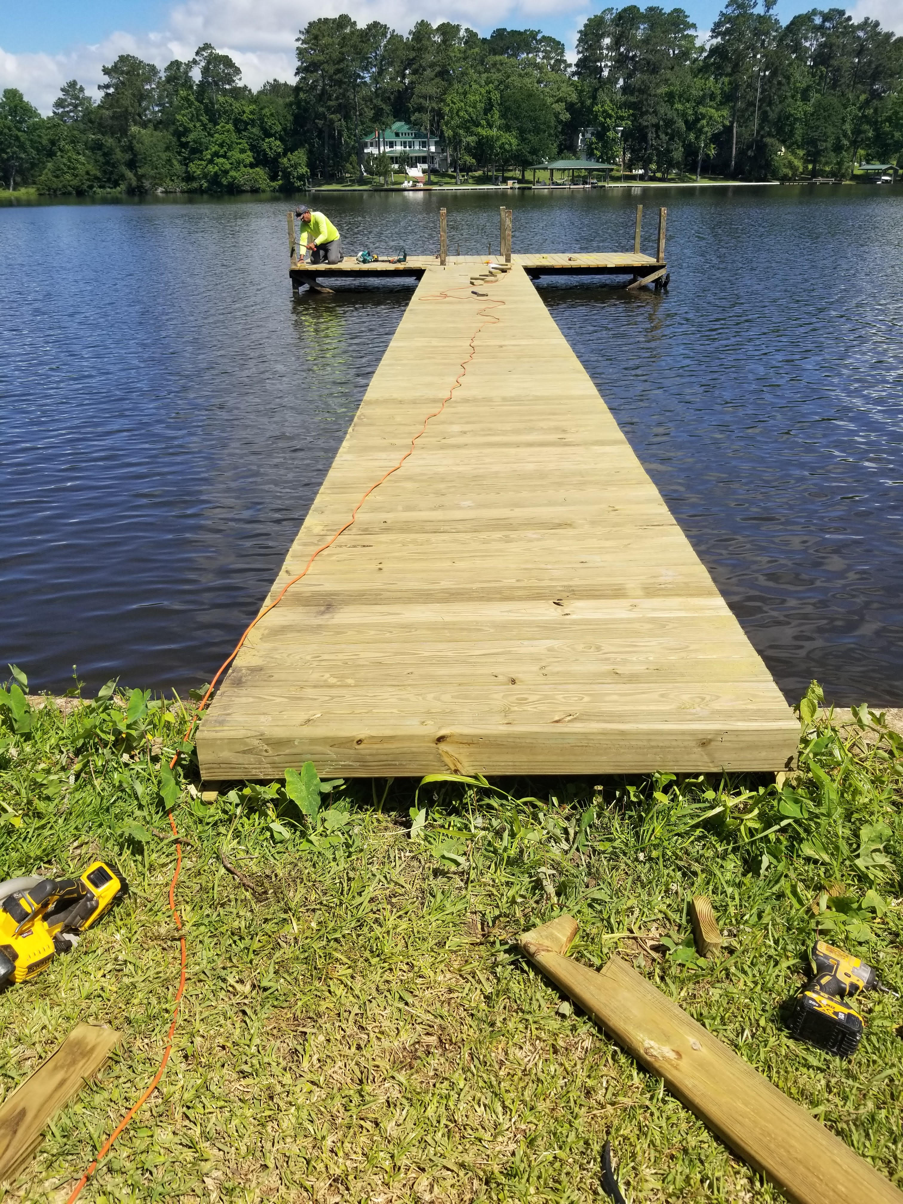 Cavalier Custom Decks crew building a wood boat dock over a Texas lake