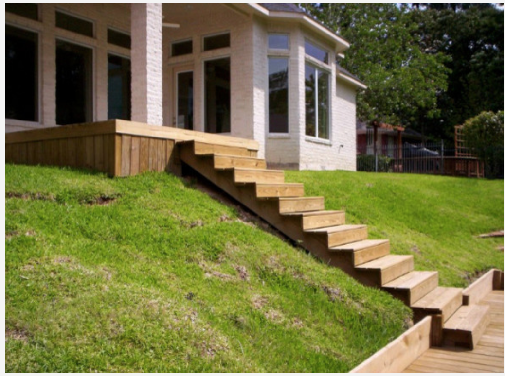 Elevated wood deck with connecting stairs in Coldspring, TX