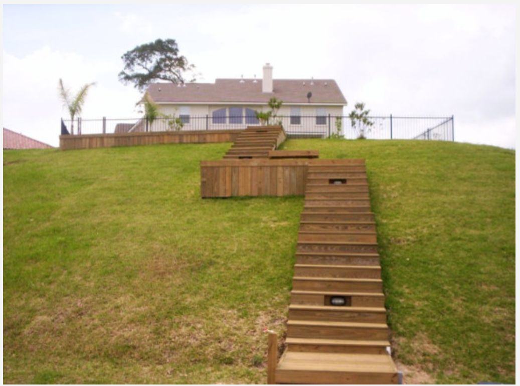 Hillside deck stairs construction by Cavalier Custom Decks in Coldspring, TX
