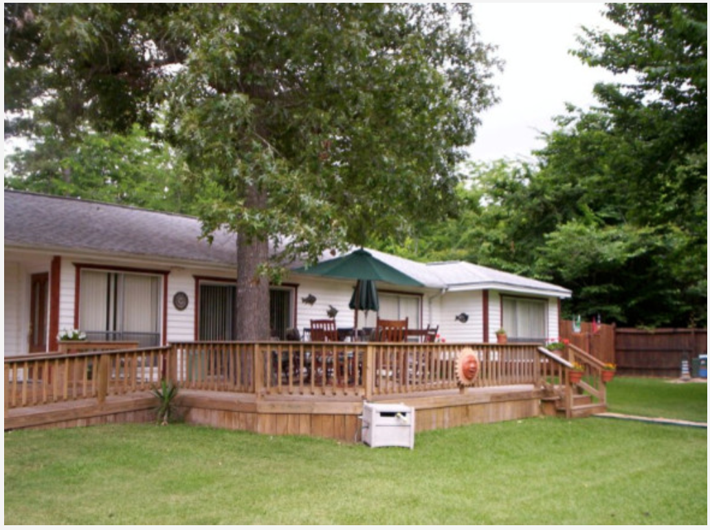 Large custom backyard entertainment deck built by Cavalier Custom Decks in Coldspring, TX