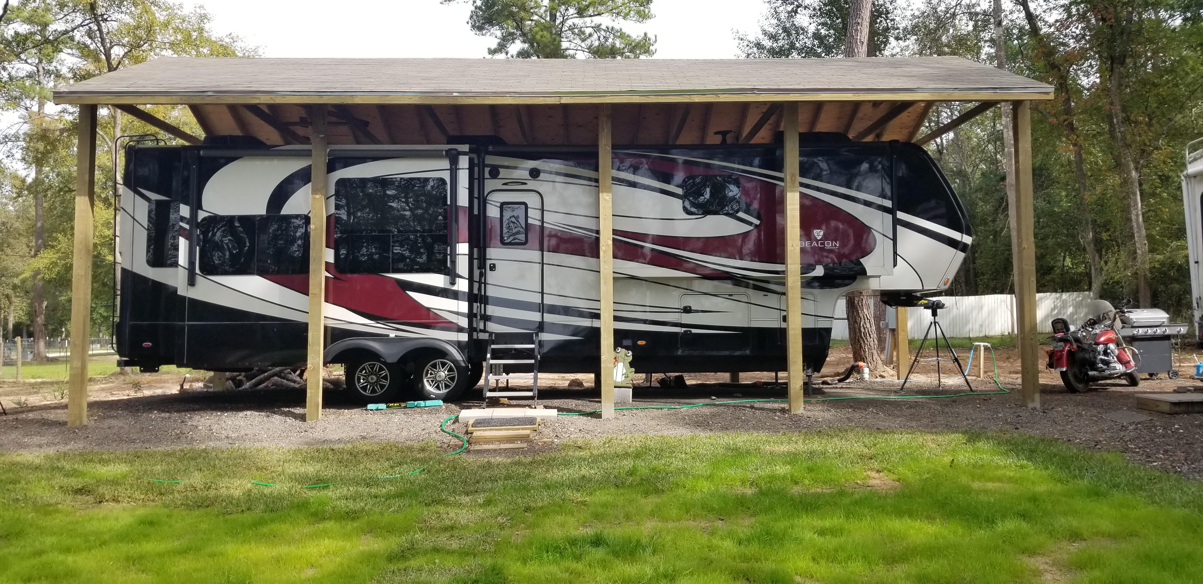 Custom wood-frame RV cover built by Cavalier Custom Decks near Conroe, TX